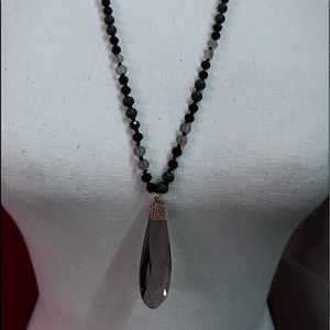 Black and grey beaded necklace with big crystal.
